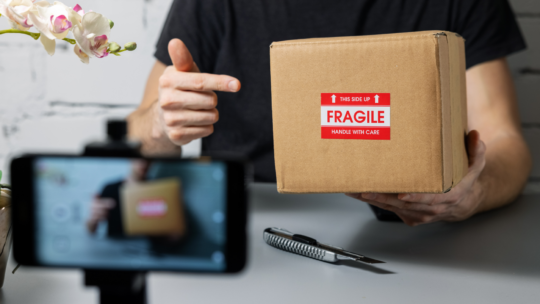 Reseller Youtuber filming an unboxing video